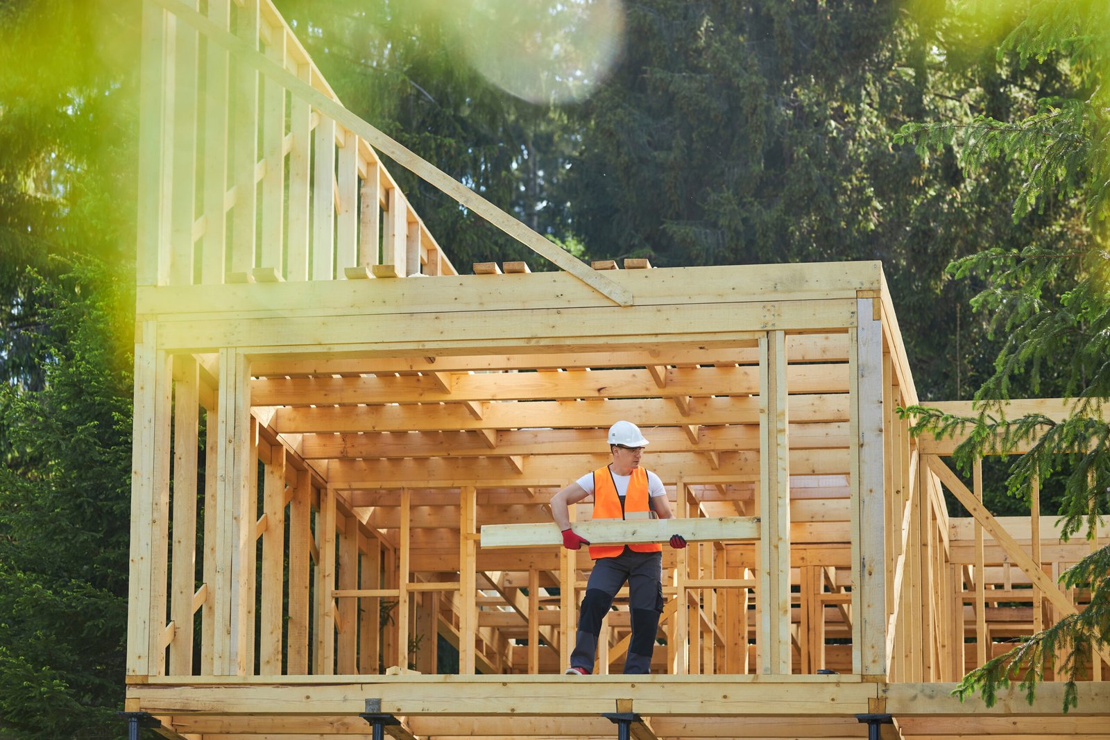 Builder working on wooden outdoor structure