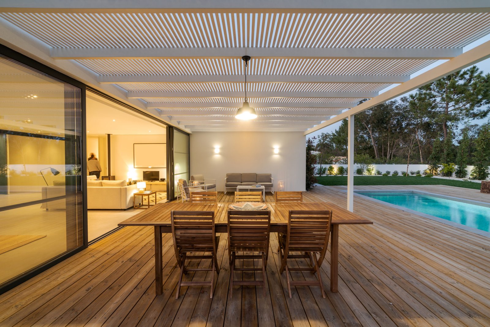 Modern house with garden, pool and wooden deck