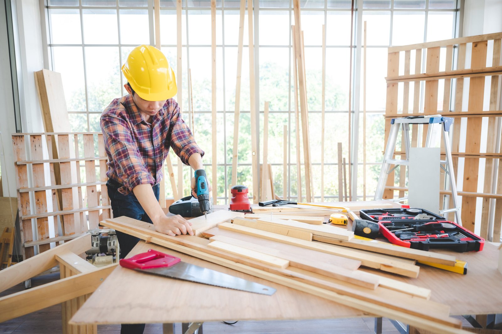 Young carpenter craftsman at work